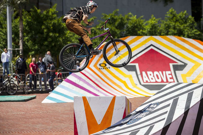 Valentino Racho does a barspin at the 2014 Red Bull Ride + Style fixed gear cycling event